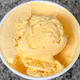 Aerial view of open pint of Van Leeuwen Kraft Macaroni & Cheese ice cream